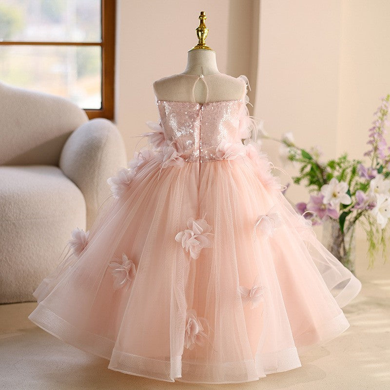 Pink tulle girls flower girl dress showing the sequinned centre-back zip bodice, back view, for wedding ceremonies.