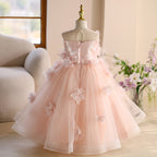 Pink tulle girls flower girl dress showing the sequinned centre-back zip bodice, back view, for wedding ceremonies.