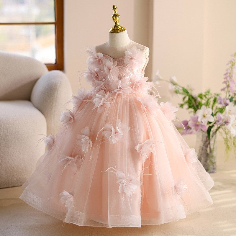 Pink tulle princess dresses for girls with a floor-length flower-trimmed skirt, side view, for pageants and parties.