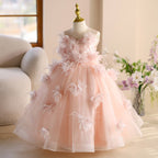 Pink tulle princess dresses for girls with a floor-length flower-trimmed skirt, side view, for pageants and parties.