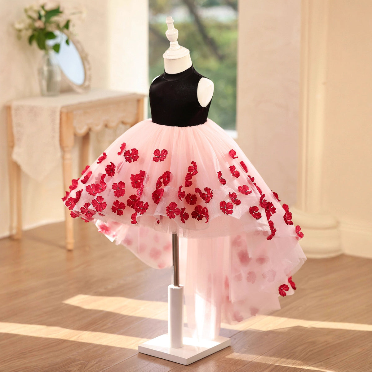 Side view of the blush pink tulle princess dresses for girls, showing the short front hem sweeping into the longer back train.