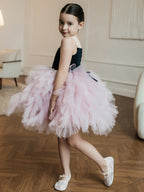 Pink and black tulle girls tutu dress with a full ruffled skirt, side view, designed for birthday parties.