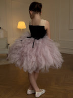 Pink and black tulle girls tutu dress with a lace-up back and ribbon tails, designed for birthday parties and photoshoots.