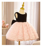 Pink and black velvet and tulle girls party dress with a pearl-trimmed neckline, 3D rosette skirt and big back bow, designed for birthdays and weddings, view 10