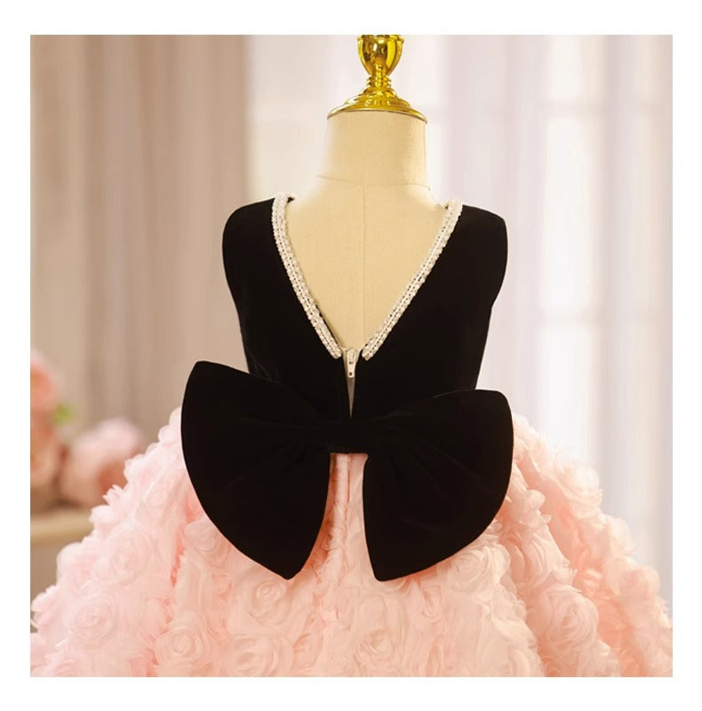 Pink and black velvet and tulle girls party dress with a pearl-trimmed neckline, 3D rosette skirt and big back bow, designed for birthdays and weddings, view 11