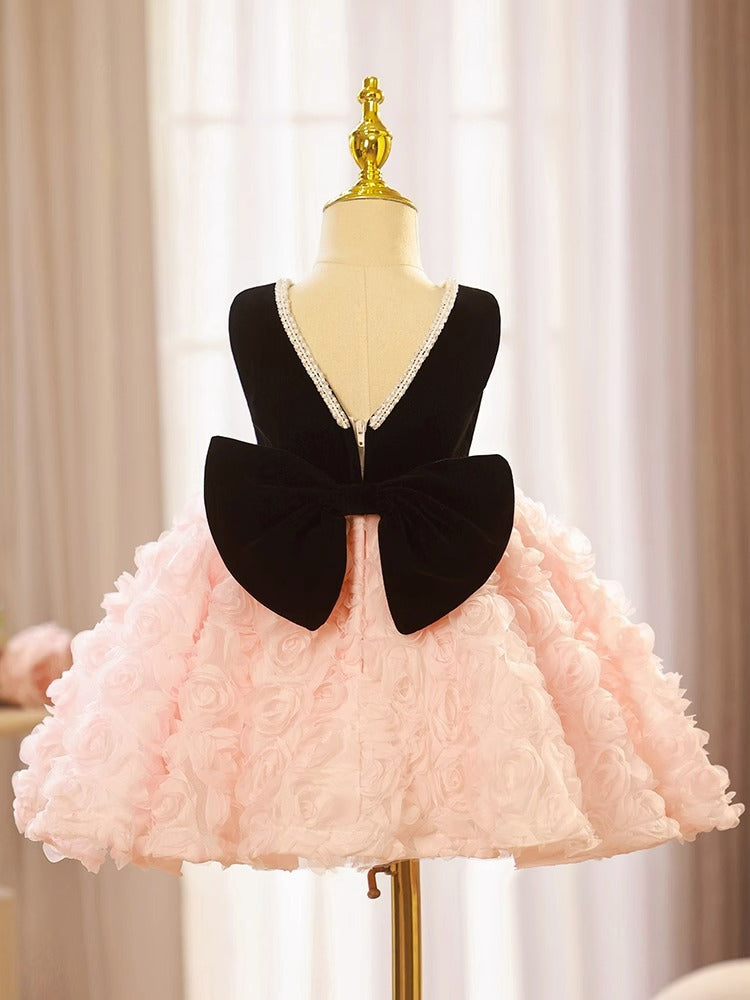 Pink and black velvet and tulle girls party dress with a pearl-trimmed neckline, 3D rosette skirt and big back bow, designed for birthdays and weddings, view 5