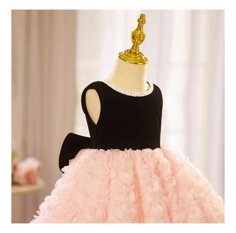 Pink and black velvet and tulle girls party dress with a pearl-trimmed neckline, 3D rosette skirt and big back bow, designed for birthdays and weddings, view 8