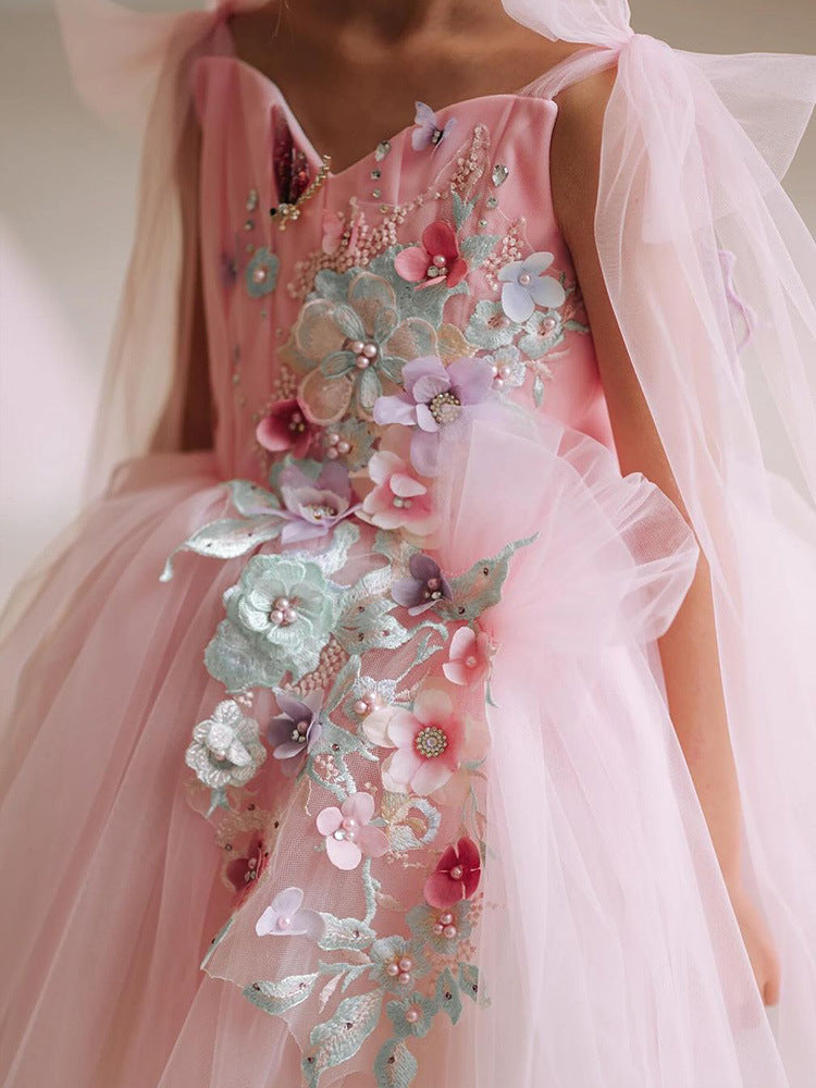 Pink tulle girls dress with 3D floral appliqué, butterfly-wing back and tulle shoulder bows, designed for birthdays and weddings, view 2
