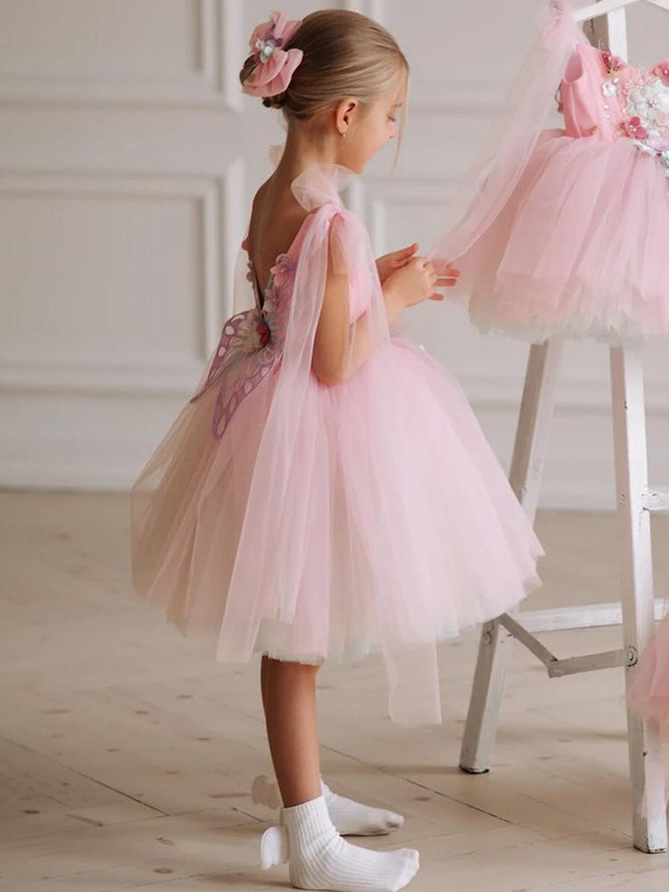 Pink tulle girls dress with 3D floral appliqué, butterfly-wing back and tulle shoulder bows, designed for birthdays and weddings, view 3