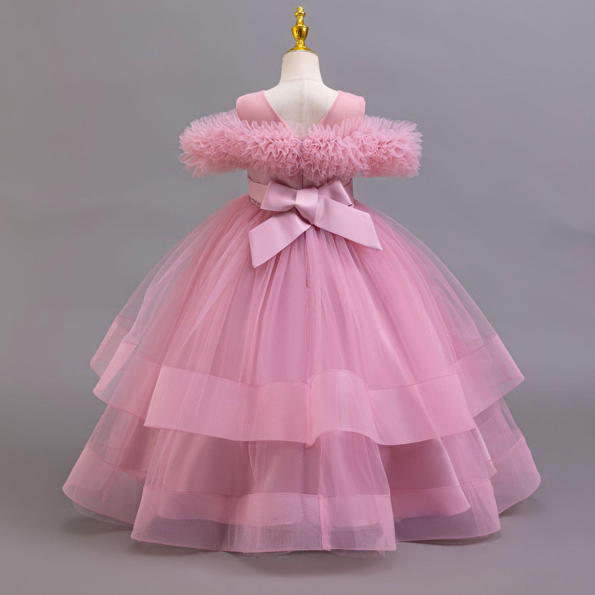 Mauve tulle girls ball gown with V back and large satin bow, designed for weddings and pageants.