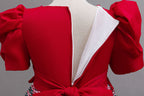 Red girls princess gown back with concealed zipper and sash bow, designed for birthday parties.