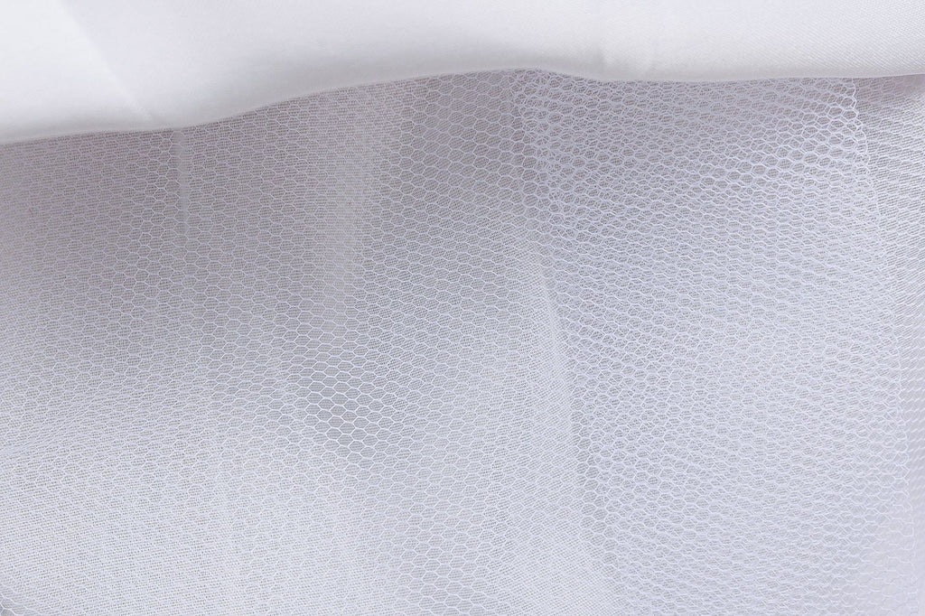 White mesh underlayer of a girls printed chiffon princess gown, designed for birthday parties.