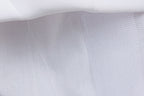 White mesh underlayer of a girls printed chiffon princess gown, designed for birthday parties.