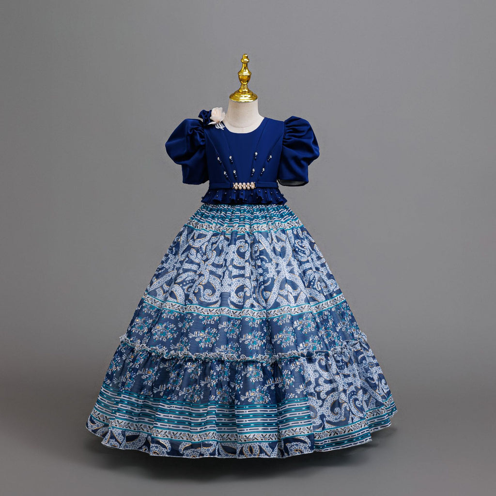 Royal Blue printed chiffon girls princess gown with puff sleeves, pearl belt and tiered skirt, designed for birthday parties.