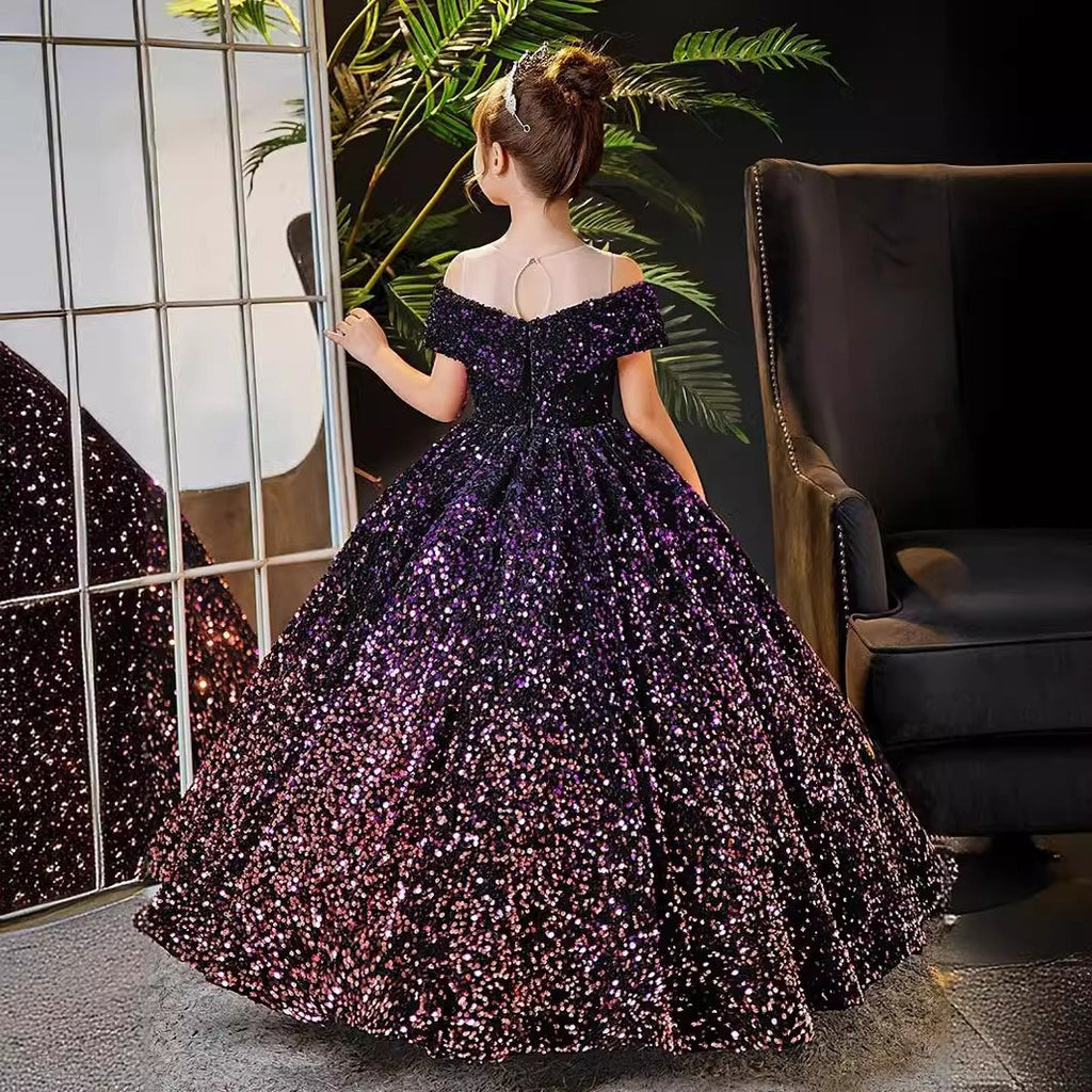 Back view of the purple sequin gown showing the shoulder straps and the sweeping train.