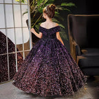 Back view of the purple sequin gown showing the shoulder straps and the sweeping train.