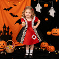 Red and black satin girls Queen of Hearts dress with heart appliqué and puff sleeves, designed for Halloween costume parties.