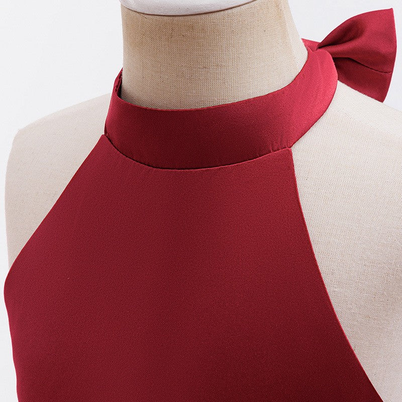 Close-up of the high halter neckline and the small bow at the nape on the red bodice.
