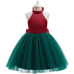 Red and green holiday dress for girls with a green tulle tutu skirt, angled side view.
