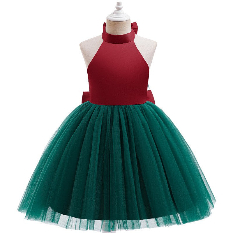 Red and green holiday dress for girls with a green tulle tutu skirt, angled side view.