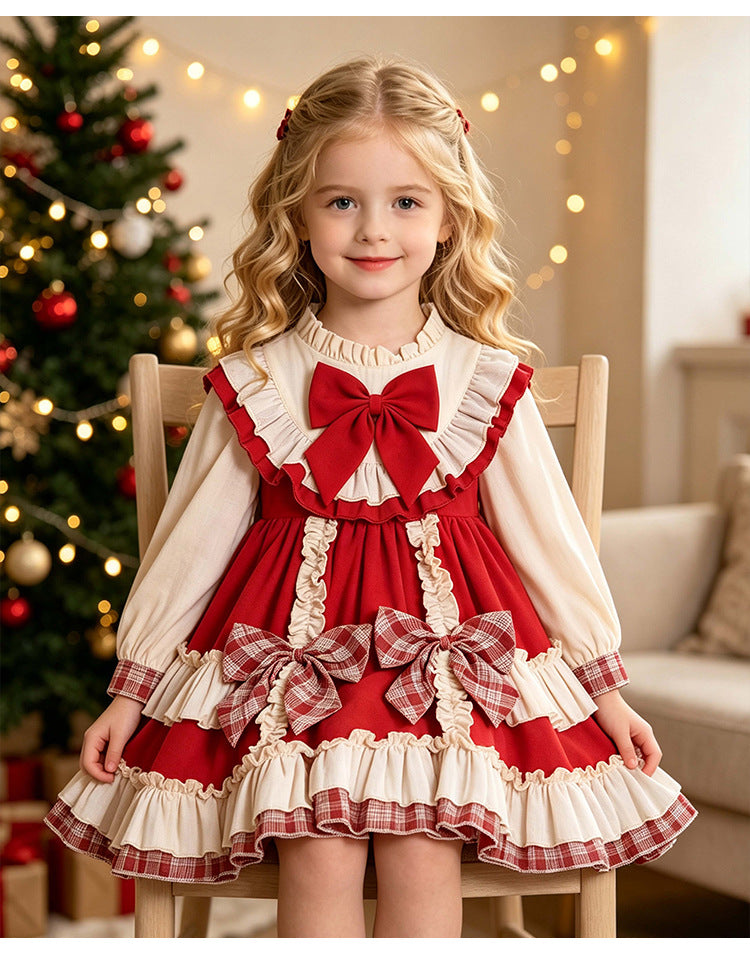 Red and ivory girls dress with plaid back bow and tiered ruffle skirt, designed for Christmas photos.