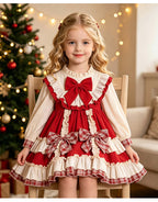 Red and ivory girls dress with plaid back bow and tiered ruffle skirt, designed for Christmas photos.