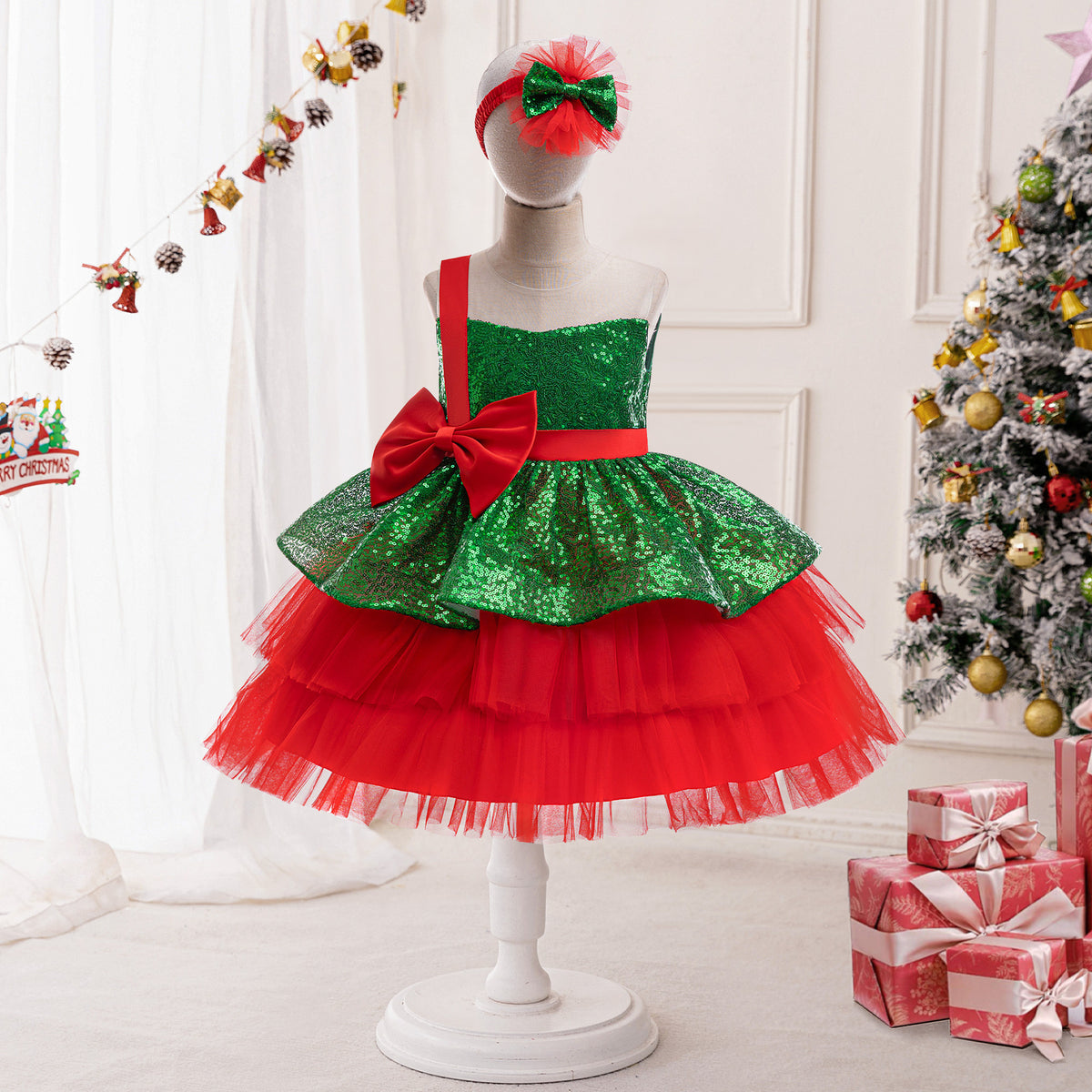 Green and red sequin girls tutu dress with a red waist sash and bow, designed for Christmas photos.