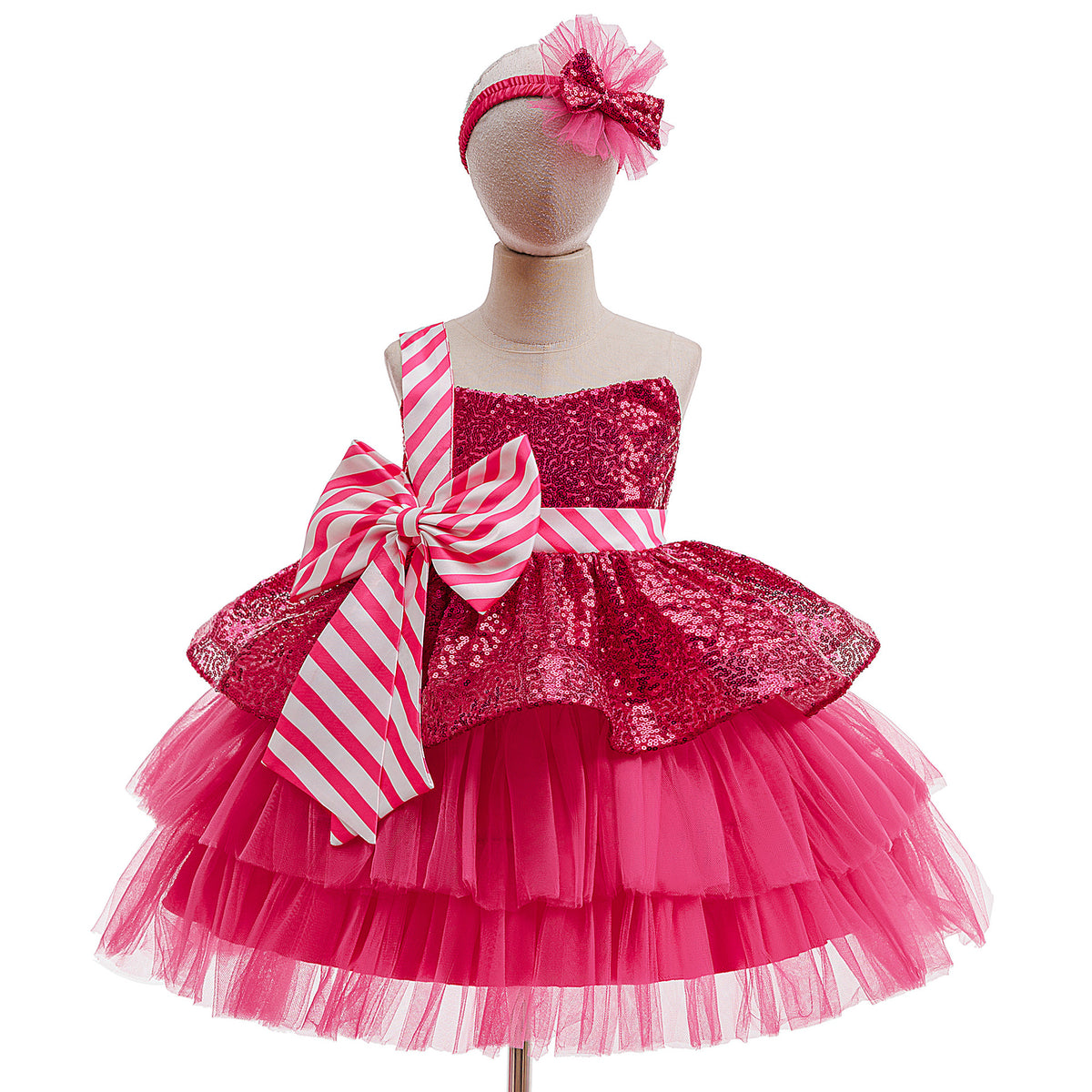 Hot pink sequin girls tutu dress with a candy-stripe bow and tiered tulle skirt, designed for Christmas parties.