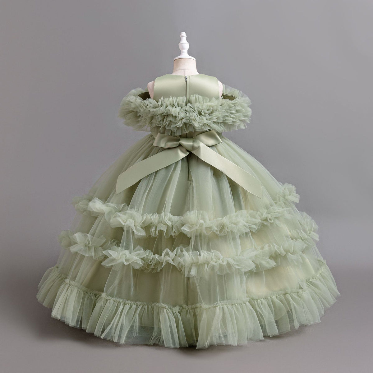 Sage Green tulle girls ball gown with satin back bow and tiered ruffle skirt, designed for flower girls and weddings.