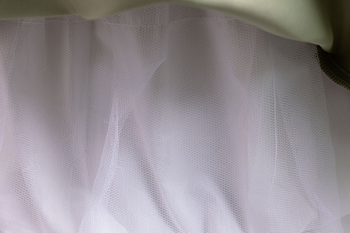 Sage Green tulle girls ball gown tulle layers close-up, designed for flower girls and weddings.