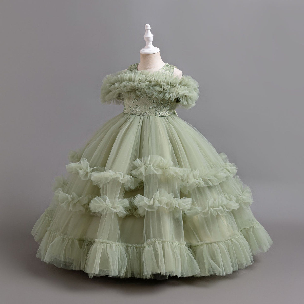Sage Green tulle girls ball gown with ruffled off-shoulder band, lace waist and tiered ruffle skirt, designed for flower girls and weddings, view 2