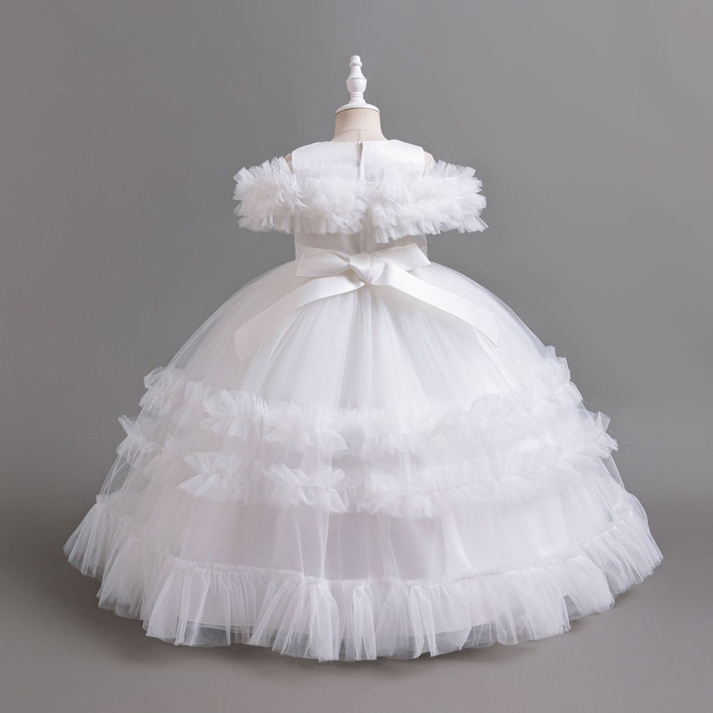 White tulle girls ball gown with satin back bow and tiered ruffle skirt, designed for flower girls and weddings.