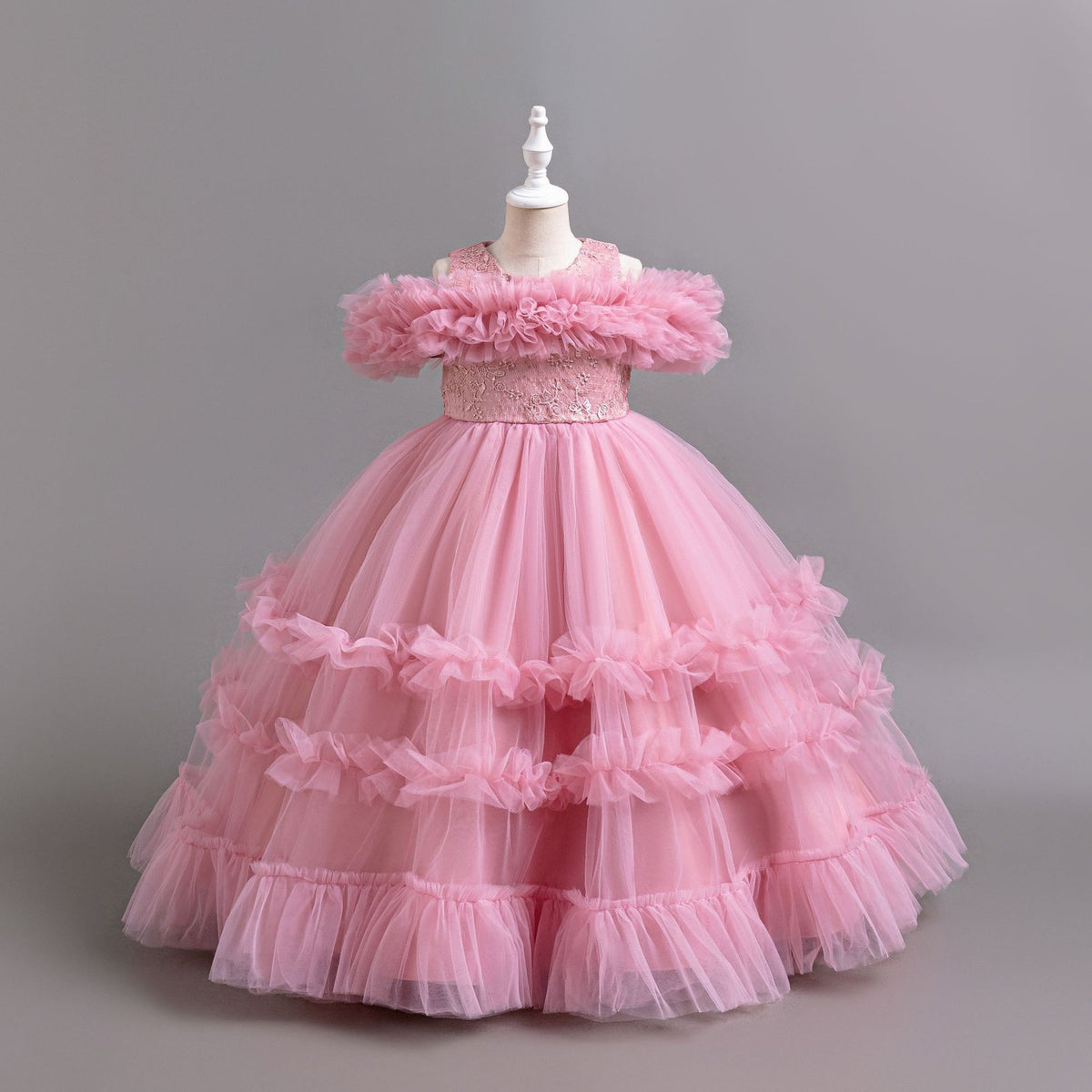 Pink tulle girls ball gown with ruffled off-shoulder band, lace waist and tiered ruffle skirt, designed for flower girls and weddings, view 3