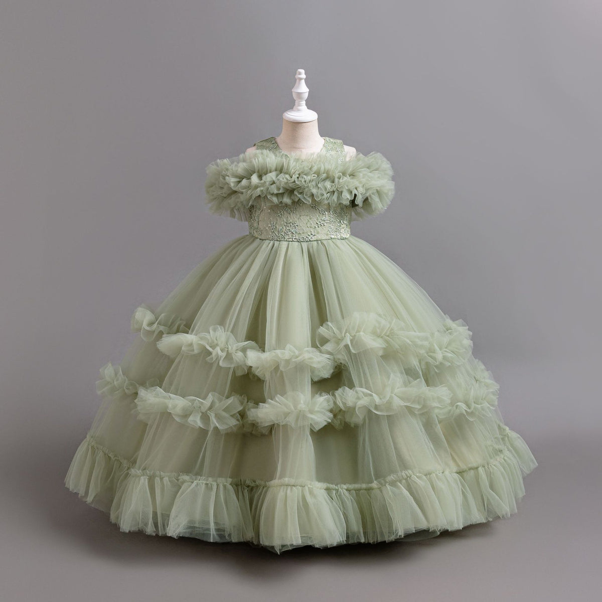 Sage Green tulle girls ball gown with ruffled off-shoulder band, lace waist and tiered ruffle skirt, designed for flower girls and weddings, view 3
