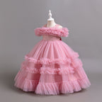 Mauve tulle girls ball gown with ruffled off-shoulder band, lace waist and tiered ruffle skirt, designed for flower girls and weddings.