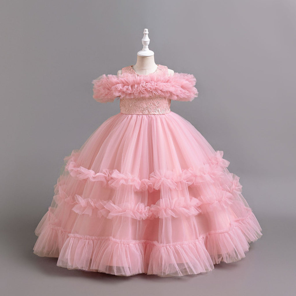 Pink tulle girls ball gown with ruffled off-shoulder band, lace waist and tiered ruffle skirt, designed for flower girls and weddings.