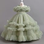 Sage Green tulle girls ball gown with ruffled off-shoulder band, lace waist and tiered ruffle skirt, designed for flower girls and weddings.
