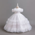 White tulle girls ball gown with ruffled off-shoulder band, lace waist and tiered ruffle skirt, designed for flower girls and weddings.