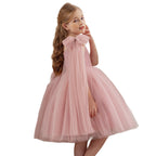 Blush pink tulle flower girl dress with a shoulder bow and full skirt, front view, for a birthday party.