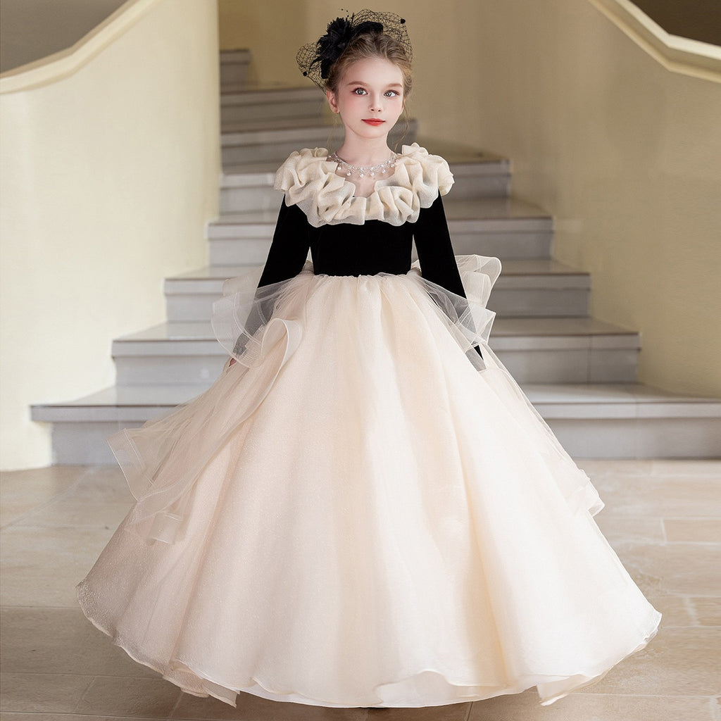 Champagne organza girls formal dress with a black velvet bodice and ruffled collar, front view, for a recital.