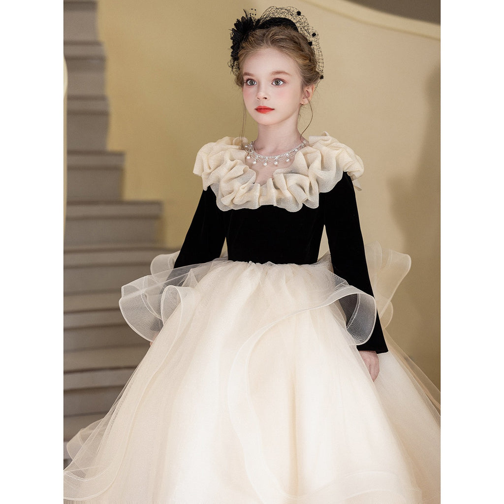 Champagne ball gown with a velvet bodice and organza sleeves, angled view, for a banquet.