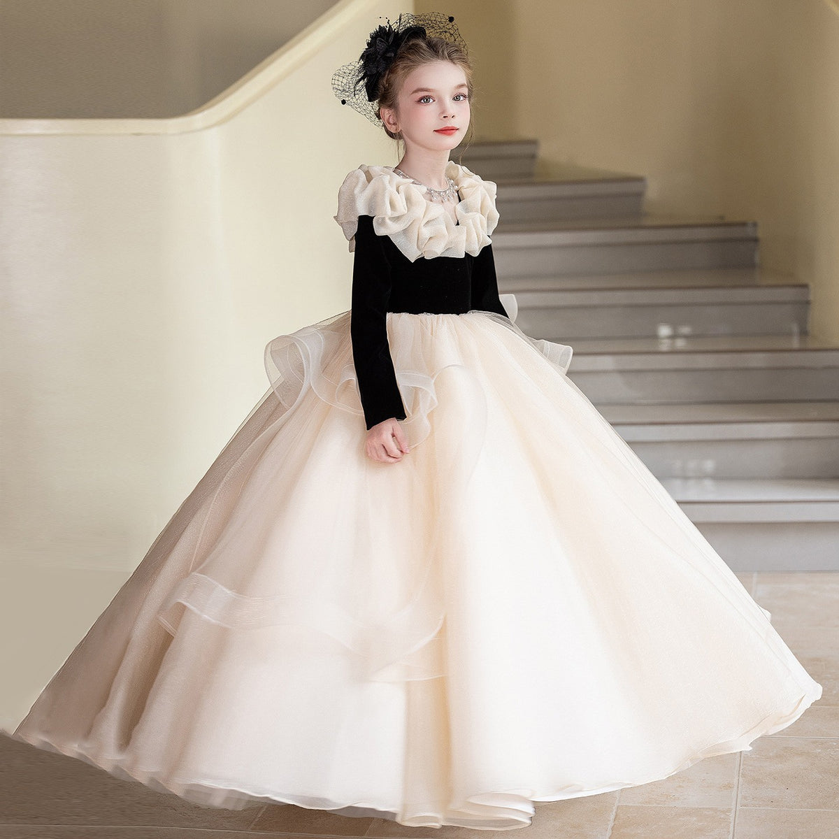 Champagne organza girls formal dress showing the layered skirt, side view 2.