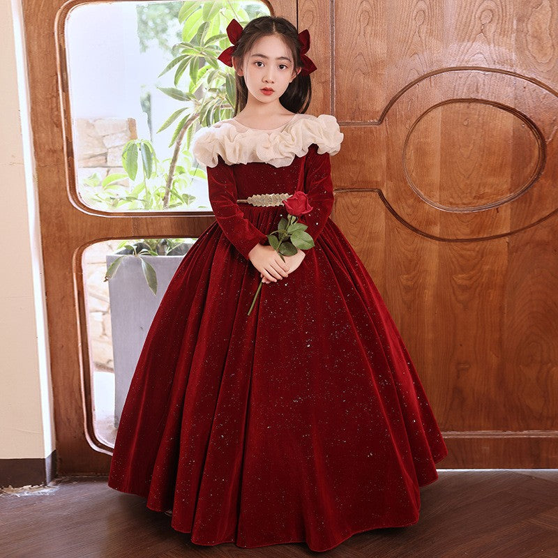 Red velvet princess dress for girls with a cream ruffled collar, front view, for a piano recital.