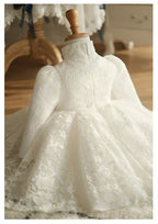 Ivory lace girls formal dress showing the plain lace back and stand collar, back view.
