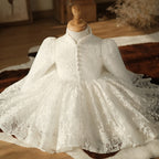 Ivory lace girls formal dress spread on a rug showing the scalloped lace hem, styled scene, view 2.