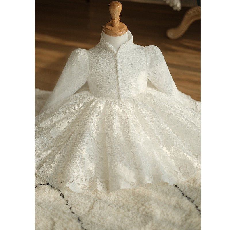Ivory lace birthday girls dress photographed close in a styled room, bodice and skirt, view 3.
