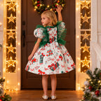 White satin girls Christmas dress side view with puff sleeves and gift box print skirt, designed for Christmas photos.