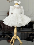 White lace girls princess dress with sheer lace yoke and ruffled organza hem, designed for flower girls and first communion.