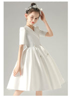 White satin girls dress with a tuxedo lapel collar, puff half sleeves and a full knee-length skirt, designed for weddings and recitals, view 10