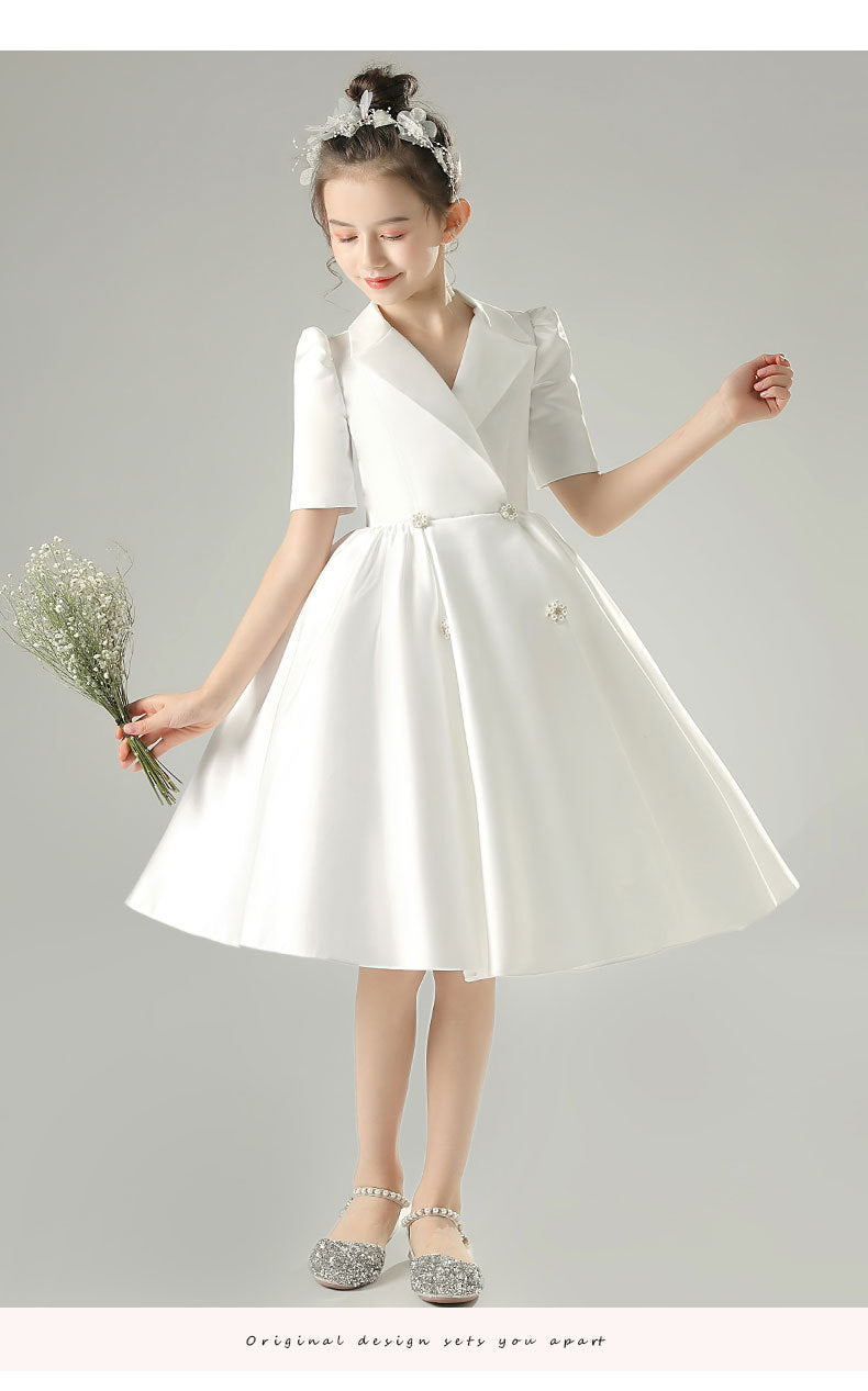 White satin girls dress with a tuxedo lapel collar, puff half sleeves and a full knee-length skirt, designed for weddings and recitals, view 11